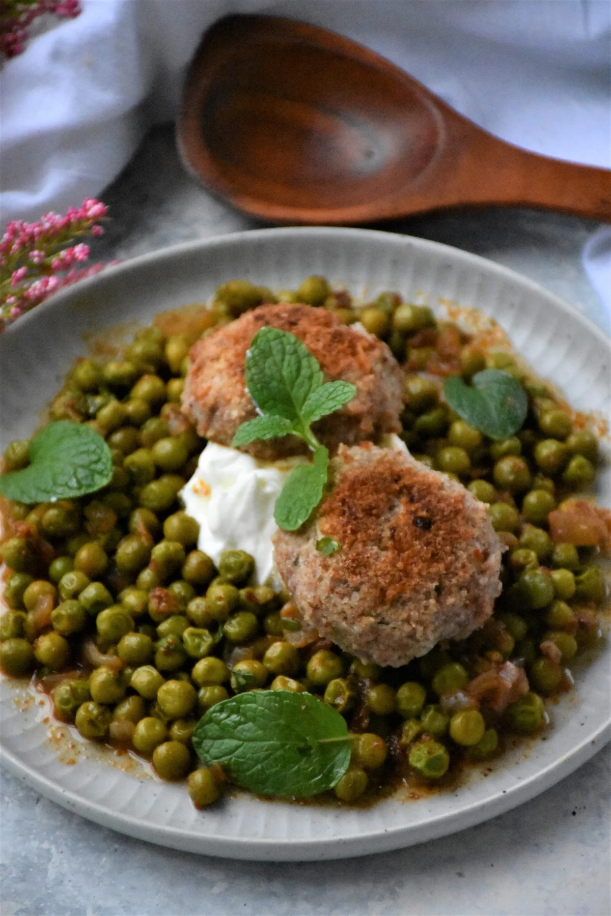 peas and meatballs on a plate