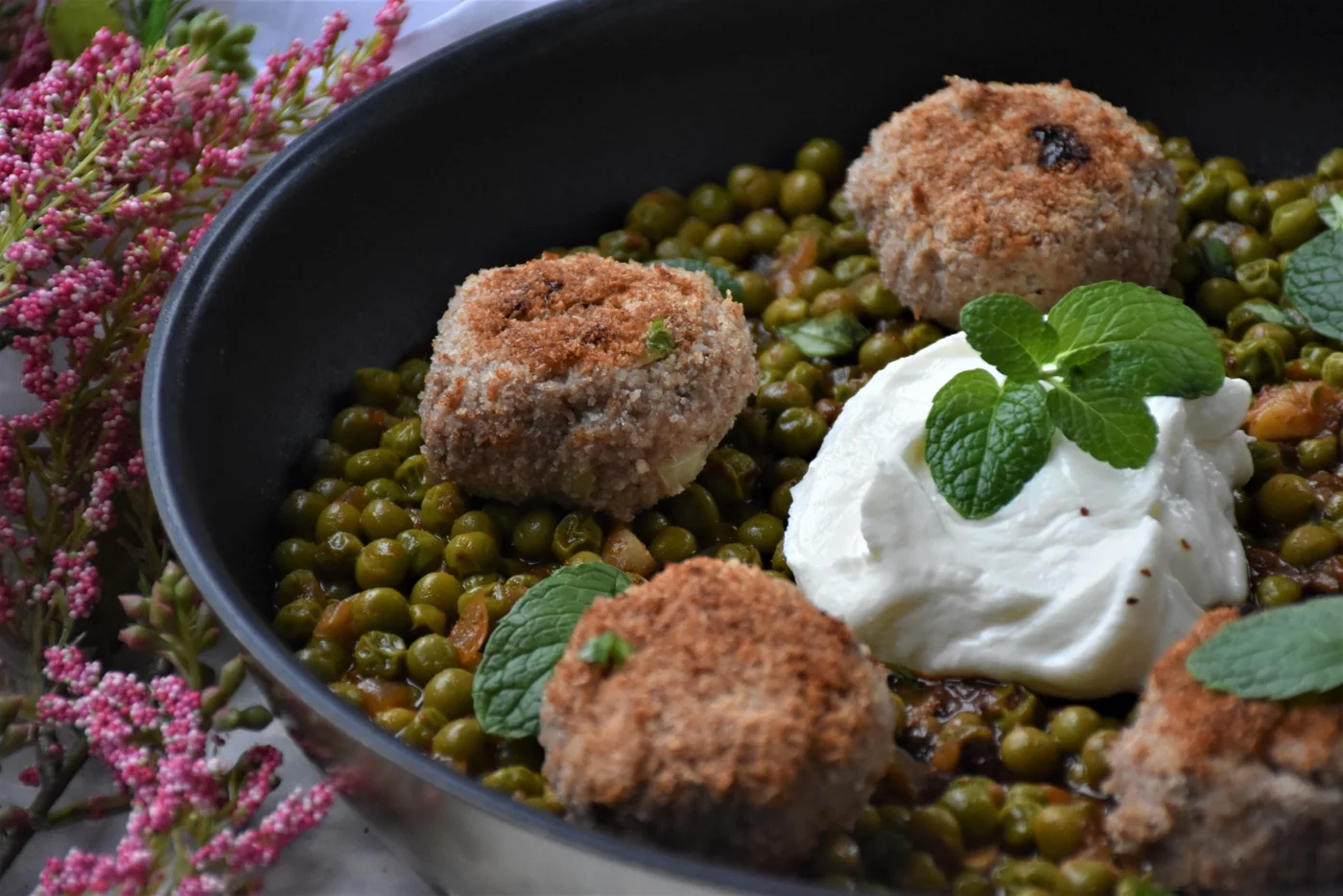 meatballs and peas in a pan